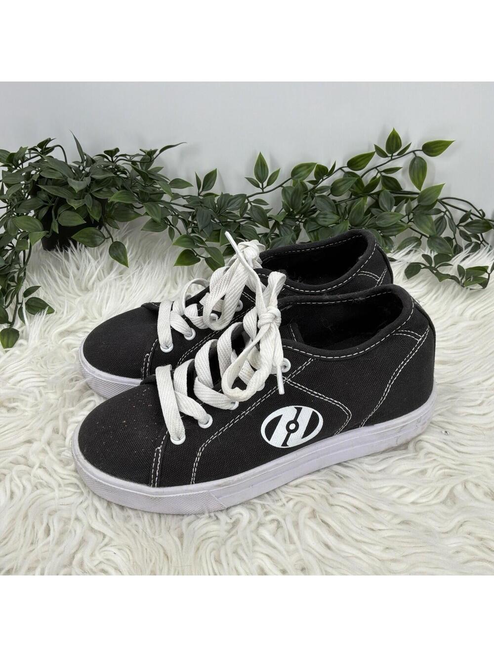 Heeleys Black And White Shoes W/wheels Size 4